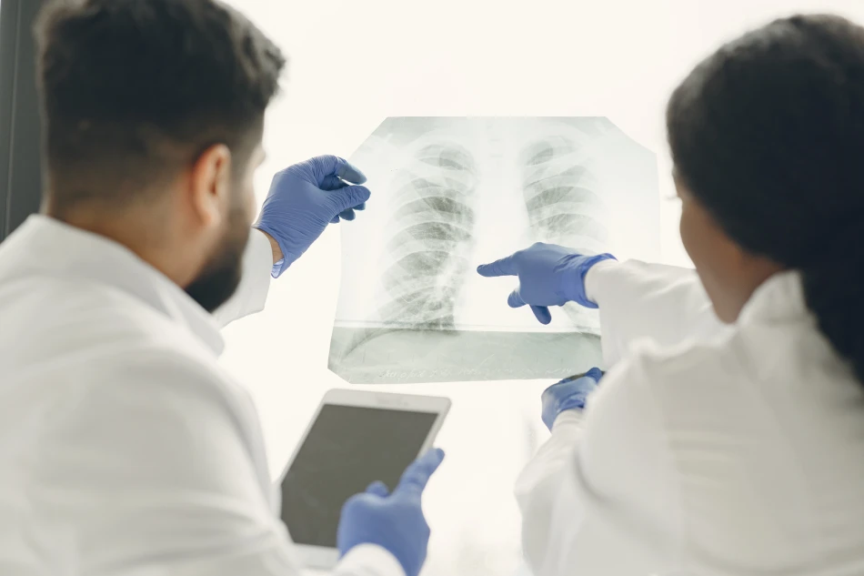 An artistic representation of the healthcare industry medical innovation and medical care concept is represented by a radiologist treating virtual human lungs and long ovarian cysts