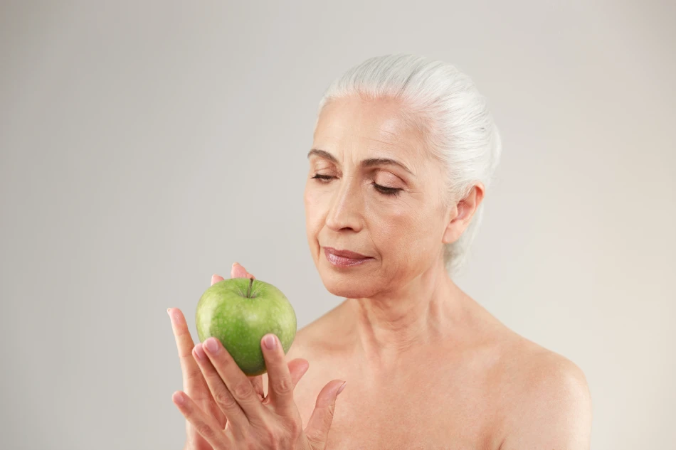 Beauty portrait of a beautiful half naked elderly woman