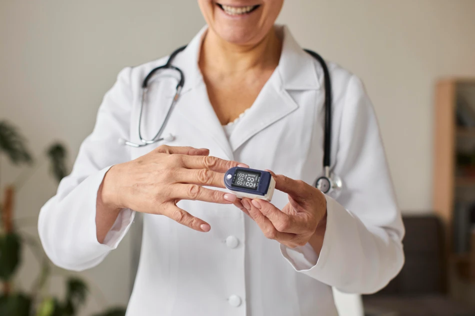 Diabetic woman using blood glucose meter, female hands hold lancet pen glucometer on finger measure sugar check insulin